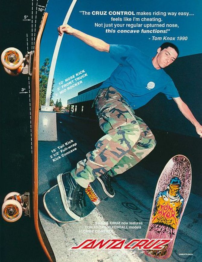 Vintage Santa Cruz skateboarding poster featuring Tom Cruz in a blue t-shirt and camouflage pants performing a trick on a ramp, with two skateboards shown vertically on the left and right sides and printed text including a quote by Tom Knox.