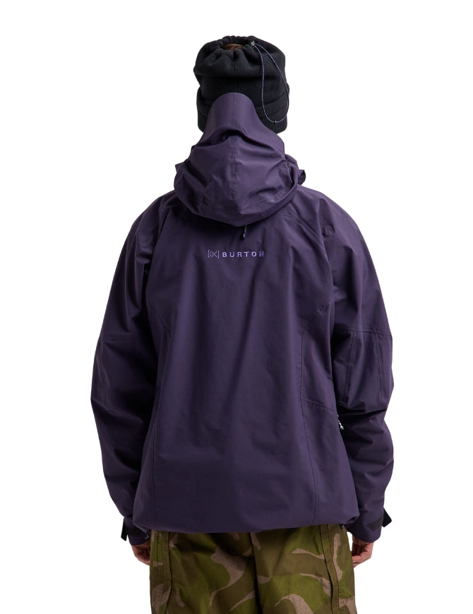 A person shown from the back wearing a dark purple hooded jacket with a small white BURTON logo on the upper back, a black beanie, and olive green camouflage pants against a plain white background.