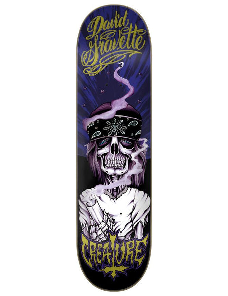 Skateboard deck with a skeleton and smoke design, featuring the brand 'Creature'.