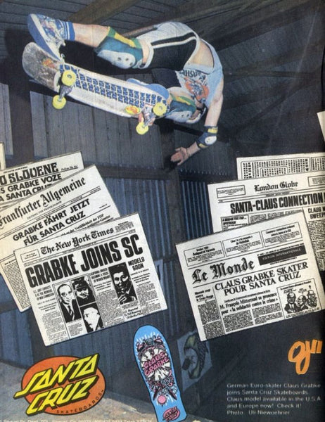 Vintage Santa Cruz skateboarding advertisement featuring a skater mid-air on a skateboard, with multiple newspaper headlines and a blue Santa Cruz deck shown at the bottom.