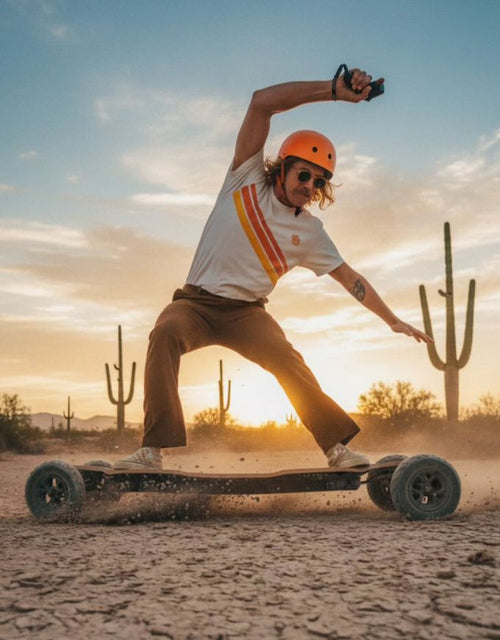Person skateboarding in a desert landscape with cacti and a sunset.