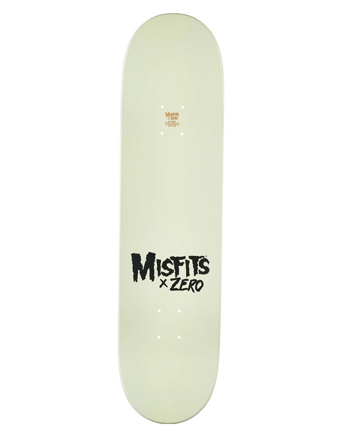 A pale yellow-green skateboard deck with black 'Misfits x Zero' text printed on the bottom, shown against a plain white background.